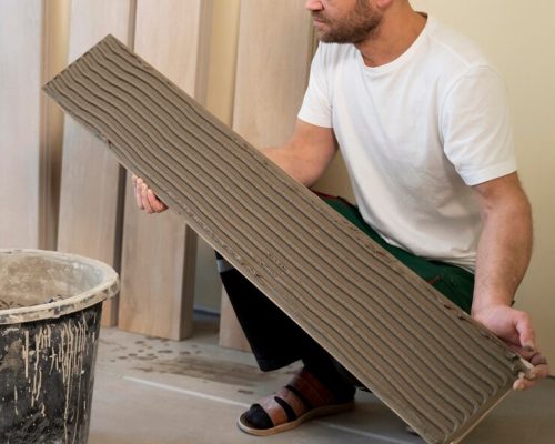 full-shot-man-tiling-floor_23-2149343991